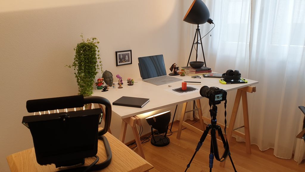 Image of camera filming the office table scene